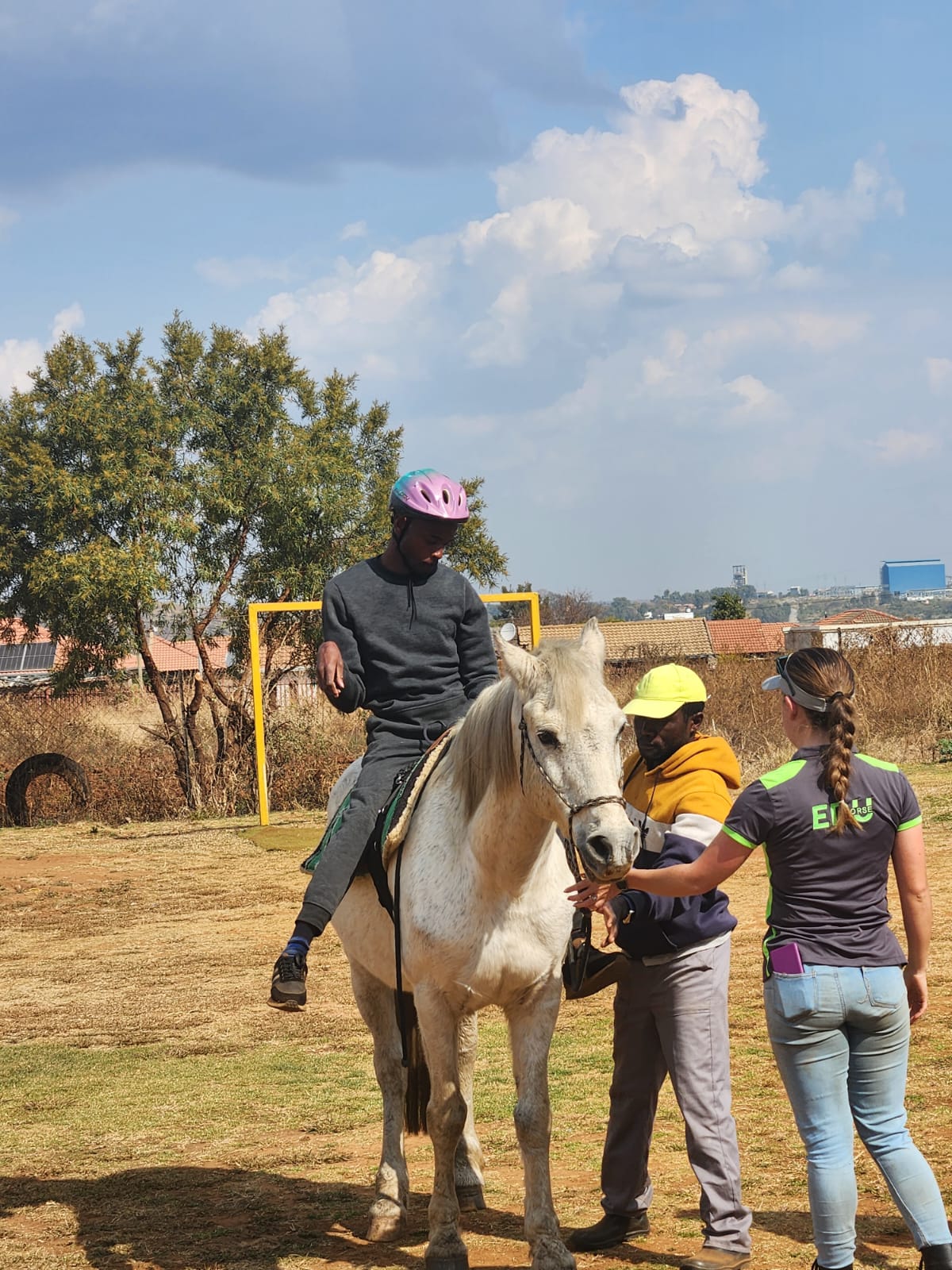 Community members joining hands at Tshepong Centre
